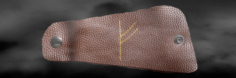 Fehu runes on skin as a talisman of good luck
