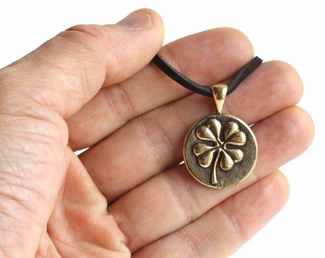 Amulet four-leaf clover brings good luck and love